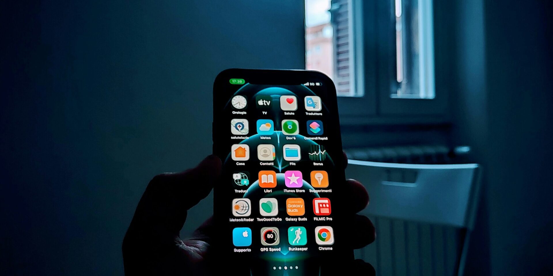 “Anonymous person holding a smartphone, symbolizing loss of privacy after nonconsensual intimate images are shared online”